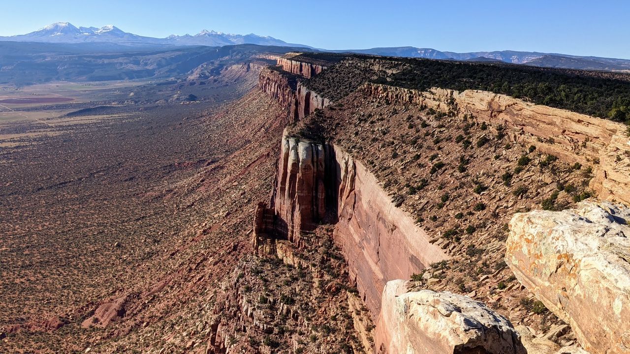 A ridge rises over Paradox Valley in southwest Colorado, with Utah's La Sal Mountains in the background. Reformers view BLM lands like these as under-appreciated conservation asset.