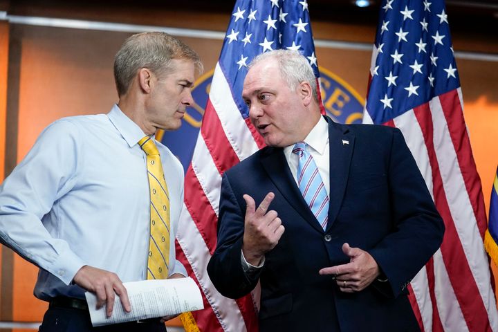 Rep. Jim Jordan, R-Ohio, left, the ranking member on the House Judiciary Committee, confers with House Minority Whip Steve Scalise, R-La., as Republican members of the House Second Amendment Caucus meet with reporters as they criticize a series of Democratic measures to curb gun violence in the wake of the mass shootings at a school in Uvalde, Texas, and a grocery in Buffalo, N.Y., at the Capitol in Washington, on, June 8, 2022. 